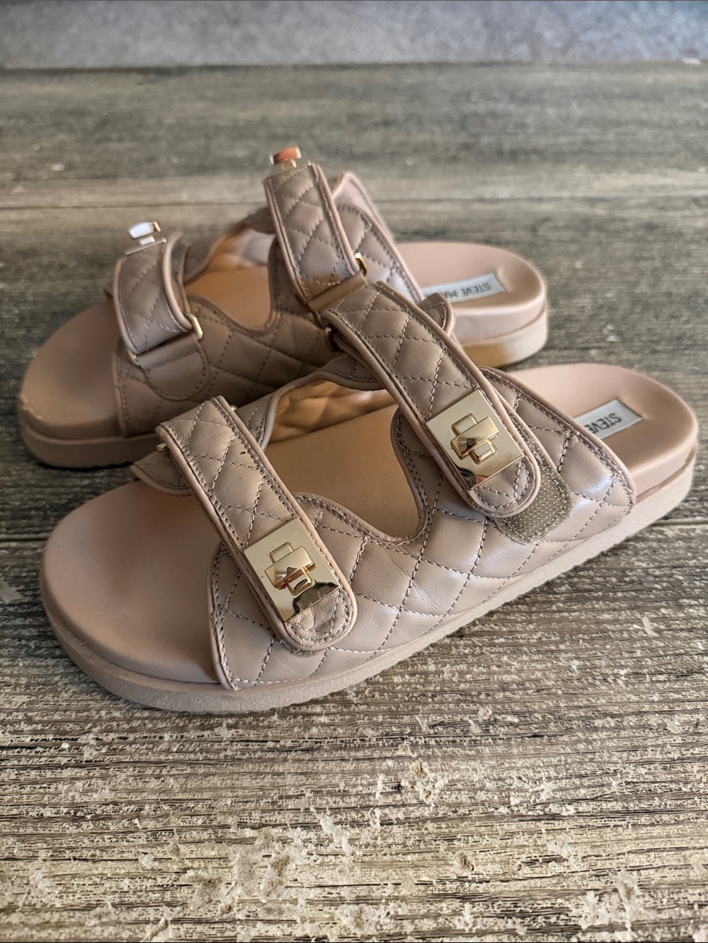 Steve Madden taupe with gold buckles elastic double strap quilted sandals.